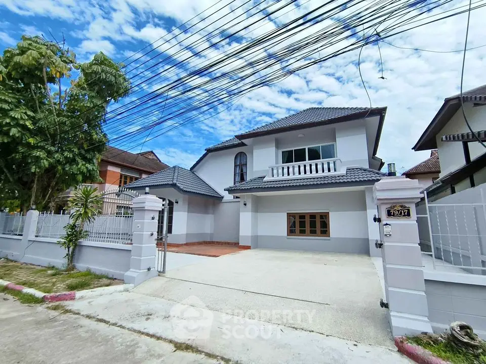 Charming two-story house with spacious driveway and modern design in a serene neighborhood.