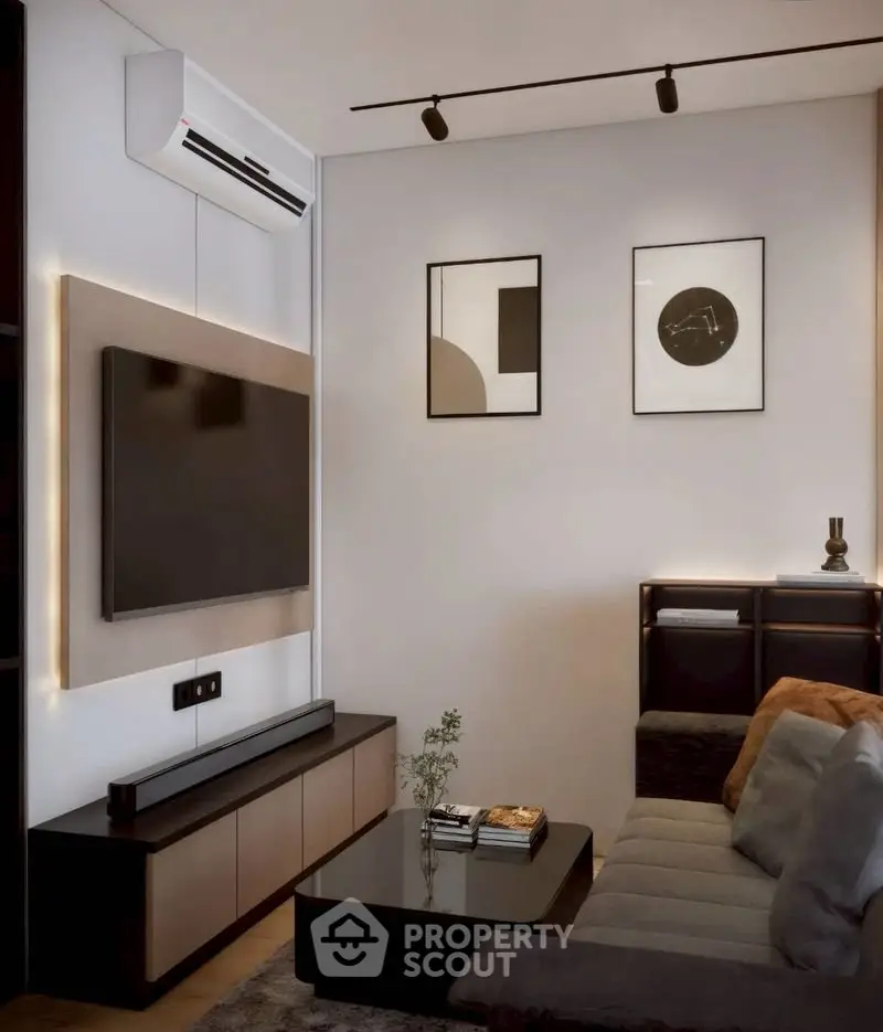 Modern living room with sleek furniture and wall-mounted TV