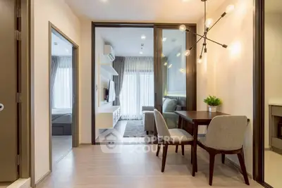Modern apartment interior with stylish dining area and cozy living room.