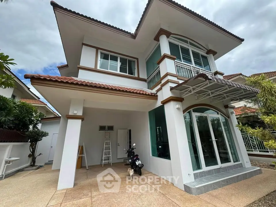 Stunning two-story house with modern architecture and spacious driveway, perfect for family living.