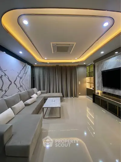 Luxurious modern living room with elegant lighting and marble accents