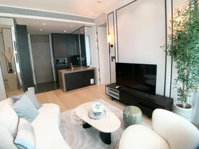 Modern living room with sleek design and open kitchen layout