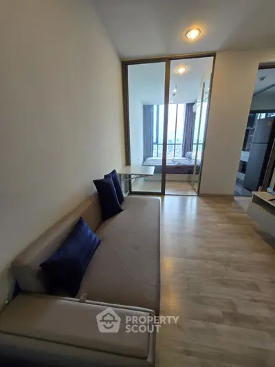 Modern apartment interior with cozy living room and bedroom view