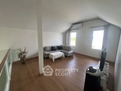 Spacious living room with modern decor and natural light