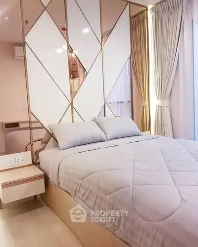 Luxurious bedroom with elegant decor and large windows for natural light
