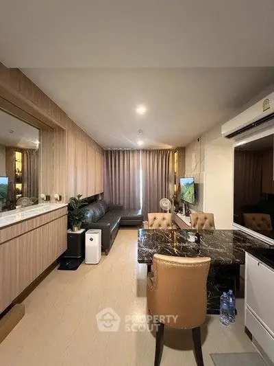 Modern living room with elegant marble dining table and cozy seating area
