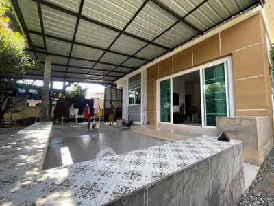 Modern covered patio with tiled flooring and sliding glass doors
