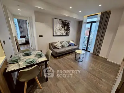 Modern living room with stylish decor and city view balcony