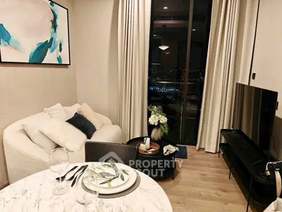 Stylish living room with modern decor and city view, featuring cozy seating and elegant dining setup.