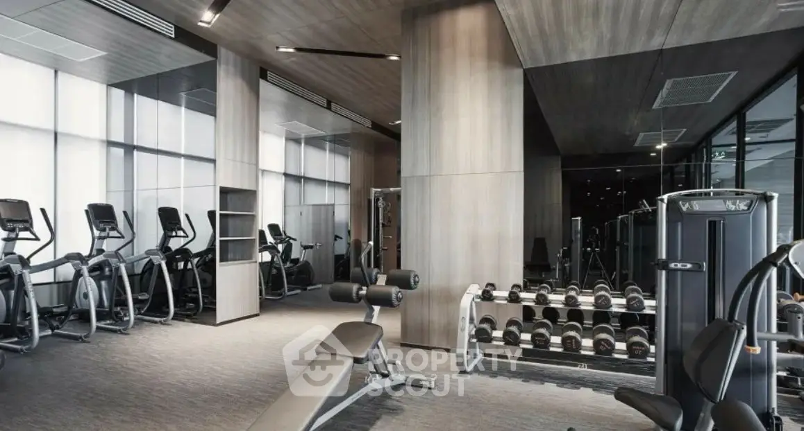 Modern gym with state-of-the-art equipment in luxury real estate property.