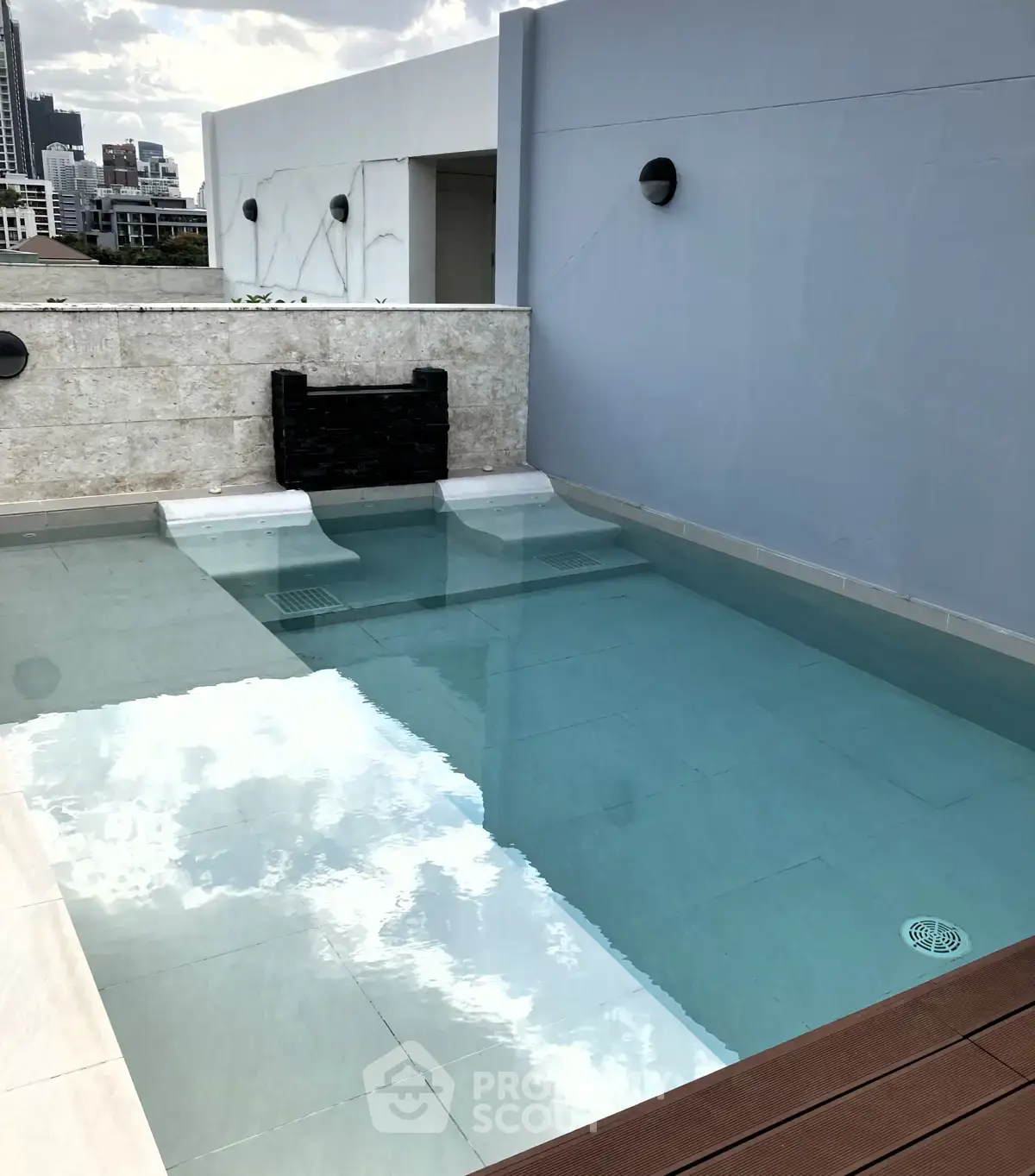 Luxurious rooftop pool with city skyline views, perfect for relaxation and entertainment.