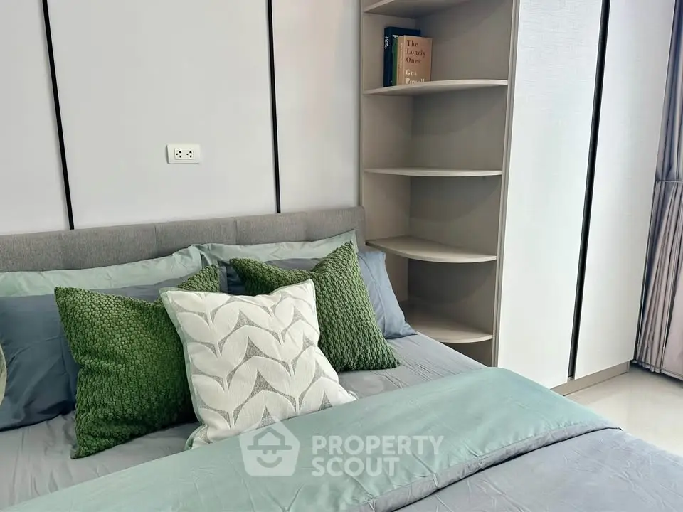 Modern bedroom with stylish decor and cozy bedding