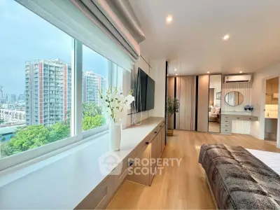 Luxurious bedroom with stunning city view and modern decor