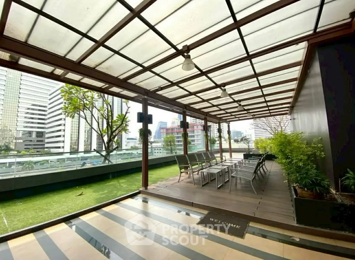 Stunning rooftop terrace with city views and modern seating area