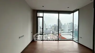 Spacious corner unit with floor-to-ceiling windows offering stunning city views.