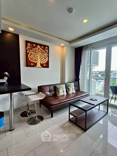 Modern living room with stylish decor and balcony view