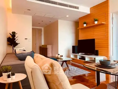 Stylish modern living room with cozy seating and entertainment center
