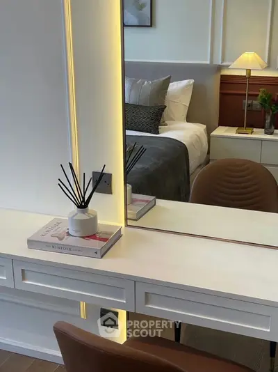 Stylish bedroom with modern vanity and elegant decor