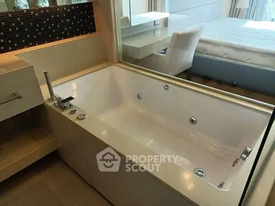 Luxurious bathroom with modern bathtub and elegant bedroom view