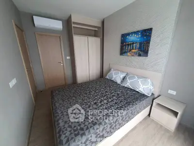 Modern bedroom with stylish decor and air conditioning in a contemporary apartment.