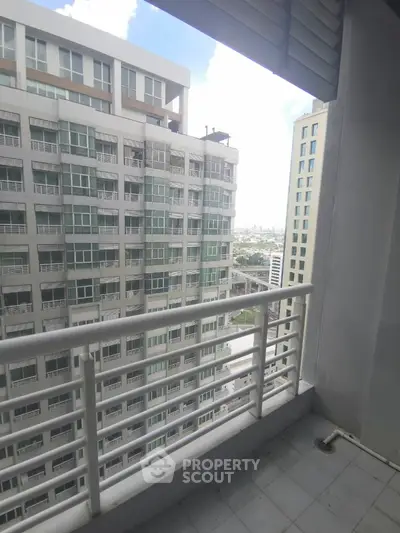 High-rise balcony with city view in modern apartment building