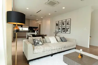 Luxurious modern living room with elegant decor and open kitchen layout