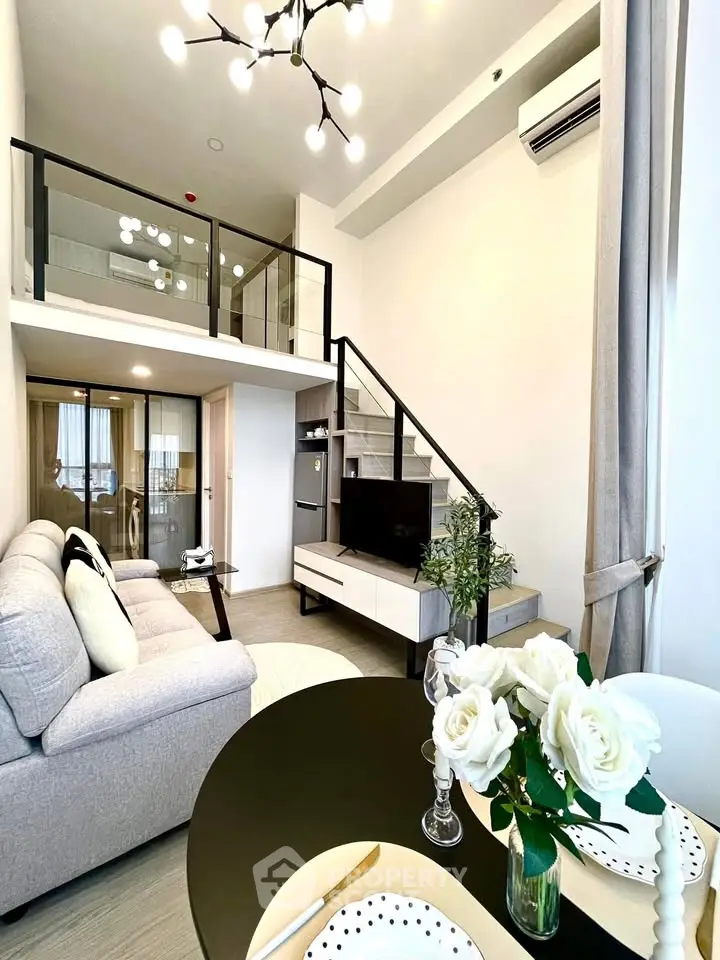 Modern loft apartment with stylish living room and elegant dining area