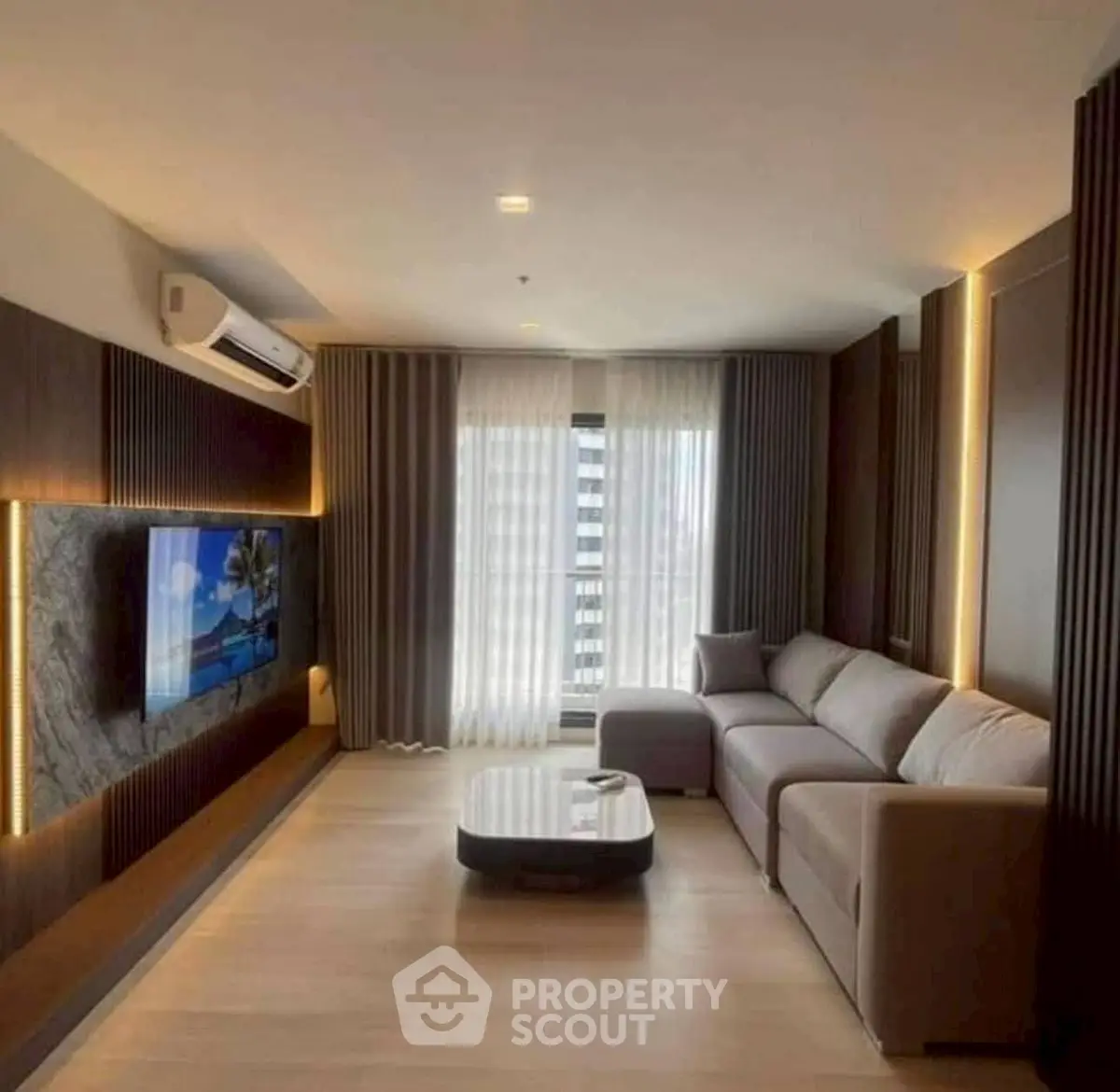 Luxurious living room with modern decor and large sofa, perfect for relaxation.