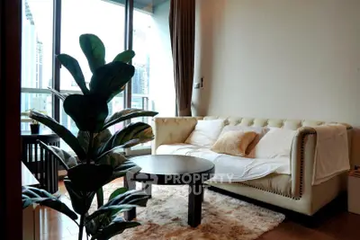 Stylish living room with plush sofa and city view, perfect for modern urban living.