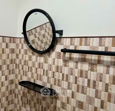 Stylish bathroom with modern round mirror and elegant tile design