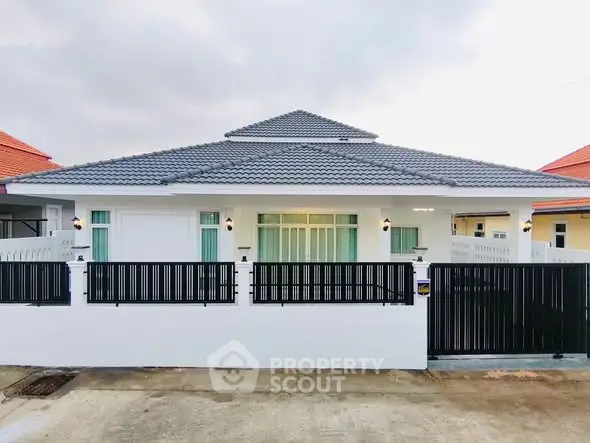 Charming single-story home with modern design and gated entrance in a serene neighborhood.