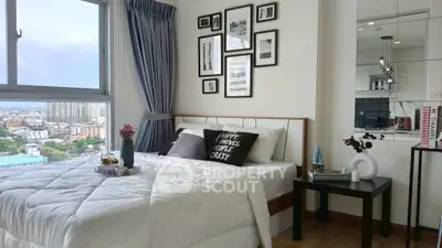 Chic modern bedroom with city view, stylish decor, and cozy ambiance.