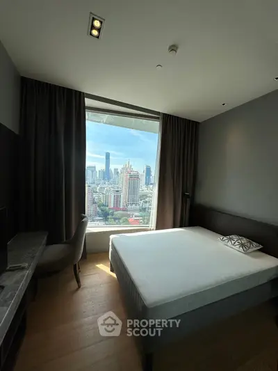 Modern bedroom with stunning city view and elegant furnishings