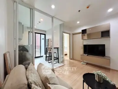 Modern living room with open layout and stylish decor in a contemporary apartment.