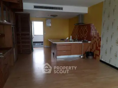 Spacious kitchen with open layout and wooden cabinets