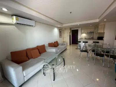 Spacious living room with modern furniture and open kitchen layout