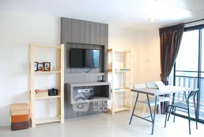 Modern living room with wall-mounted TV and balcony access