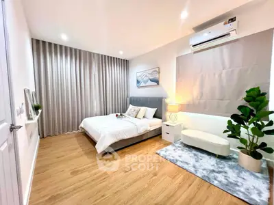 Spacious modern bedroom with elegant decor and natural light