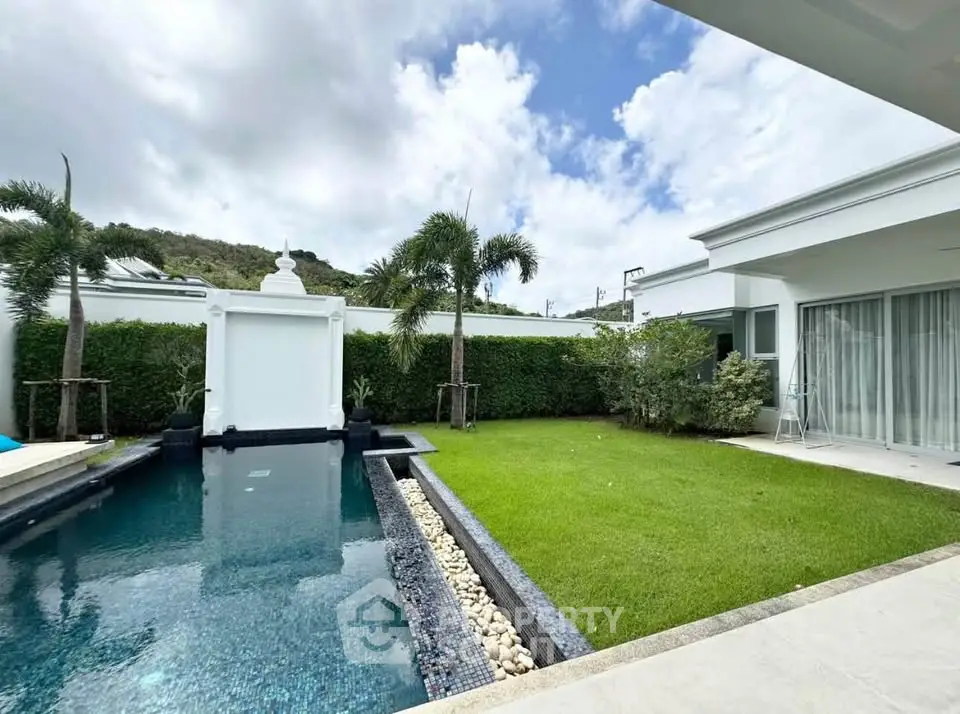 Luxurious villa with private pool and lush garden, perfect for relaxation and entertaining.