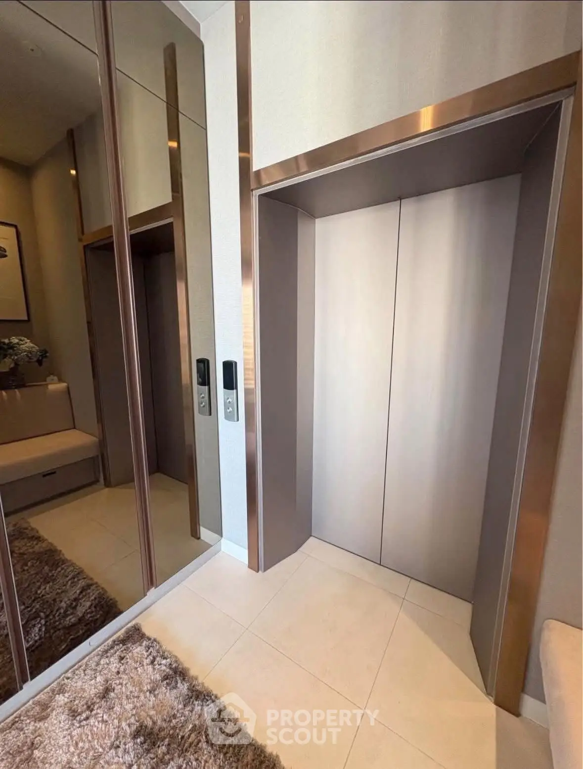 Modern elevator lobby with sleek design and mirrored walls