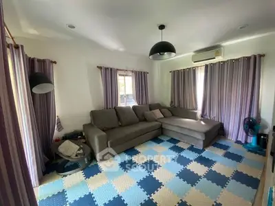Spacious living room with modern sectional sofa and stylish lighting