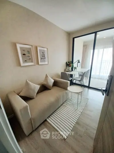 Cozy living room with modern decor and balcony access