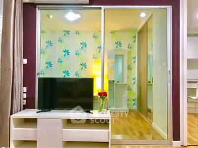 Modern living room with floral wallpaper and sleek TV stand
