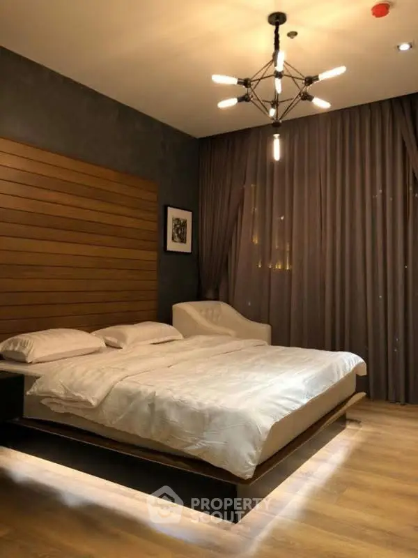 Luxurious bedroom with modern lighting and elegant decor