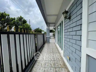 Charming home exterior with spacious balcony and elegant railing
