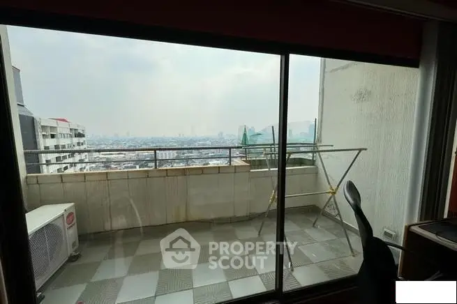 Spacious balcony with stunning city view, perfect for relaxation and enjoying the skyline.