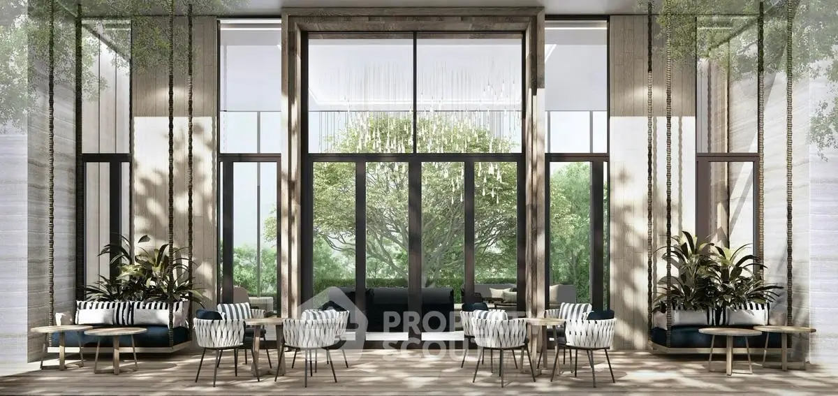Luxurious modern lobby with elegant seating and floor-to-ceiling windows overlooking lush greenery.