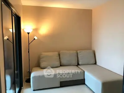 Cozy living room with sectional sofa and warm lighting