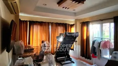 Cozy living room with exercise equipment and natural light