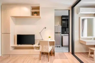 Modern studio apartment with open layout, featuring a cozy living area, compact kitchen, and stylish decor.